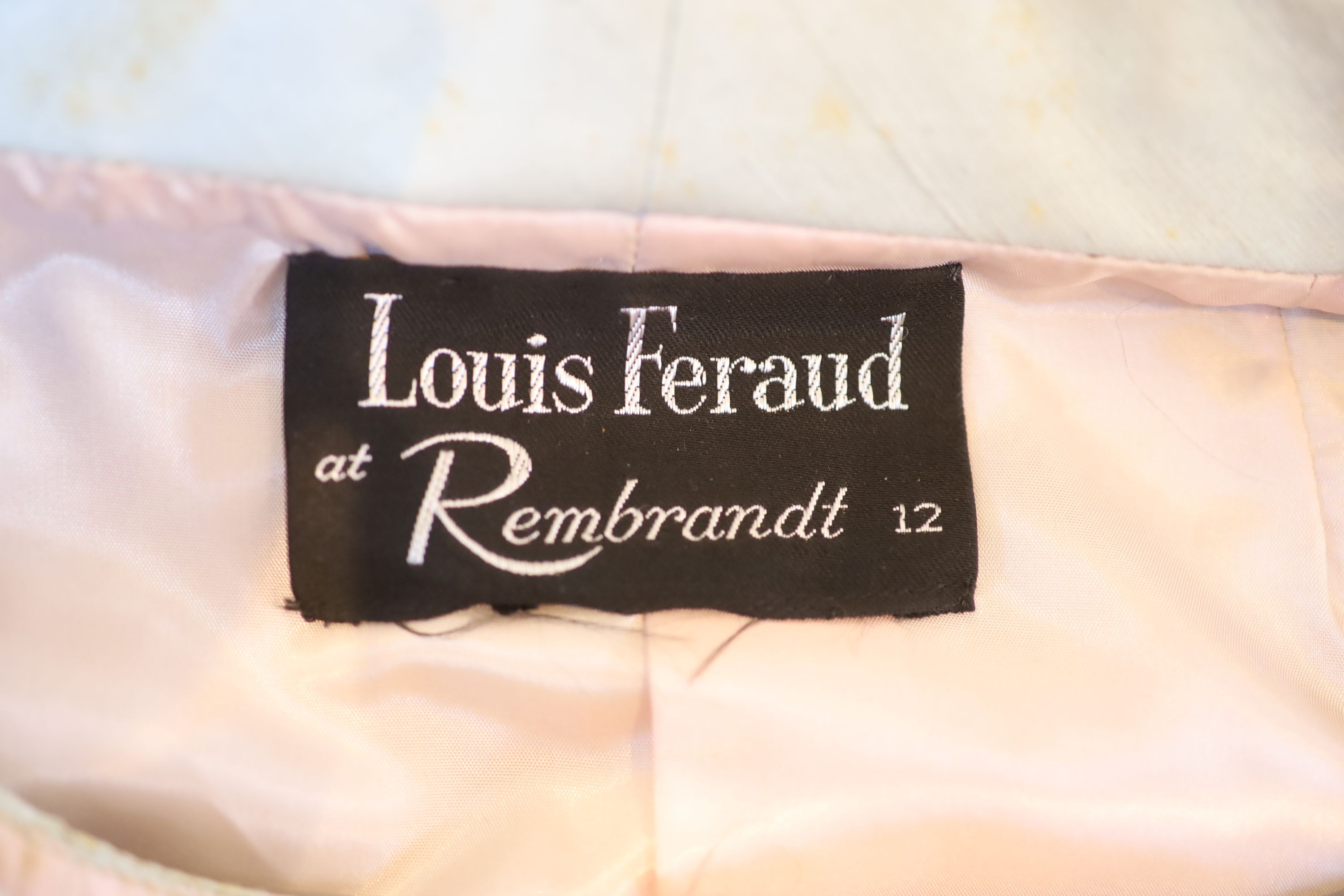 A pale green silk dress and jacket, labelled Louis Feraud,